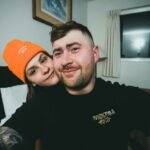 a man and a woman posing for a picture